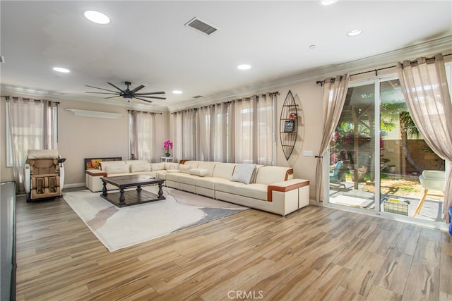 living room featuring wood-type flooring and ceiling fan