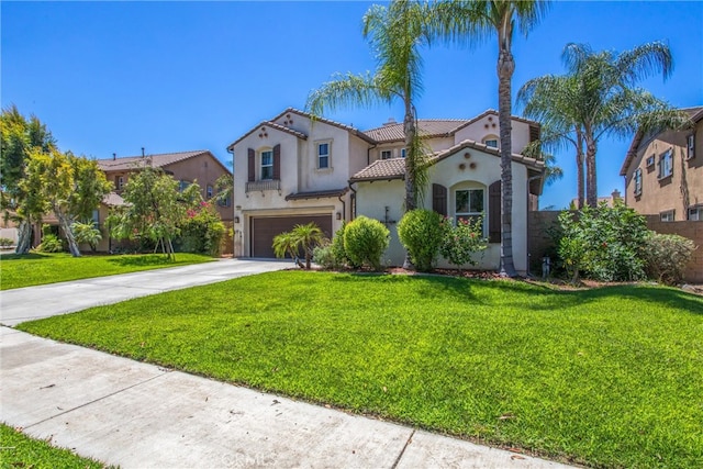 mediterranean / spanish-style house with a garage and a front lawn