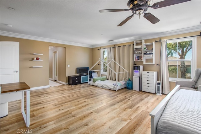 bedroom featuring ceiling fan, ornamental molding, wood-type flooring, a textured ceiling, and fridge