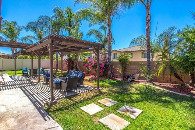 view of yard with outdoor lounge area, a pergola, and a patio