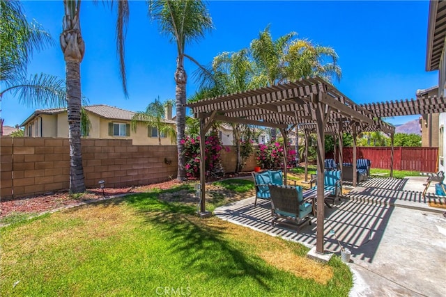 view of yard with a pergola and a patio