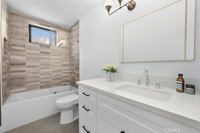 full bathroom with vanity, tiled shower / bath combo, and toilet