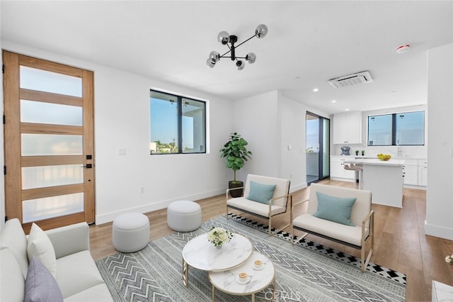living room with light hardwood / wood-style flooring