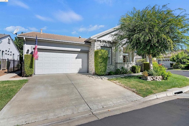 view of front of home with a garage and a front yard