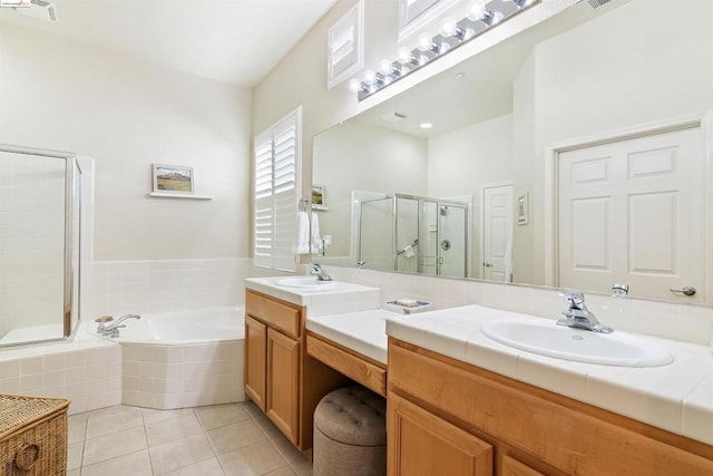 bathroom with vanity, tile patterned floors, and shower with separate bathtub