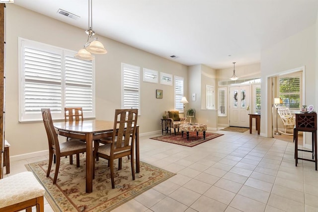 dining room featuring light tile patterned flooring