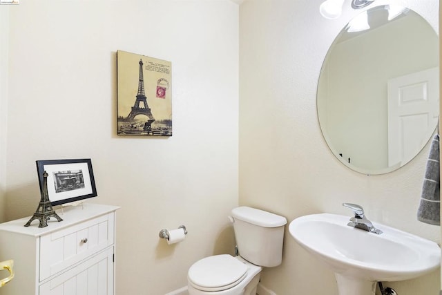 bathroom with sink and toilet