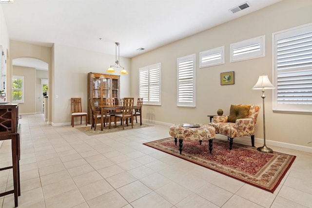 living area featuring light tile patterned flooring