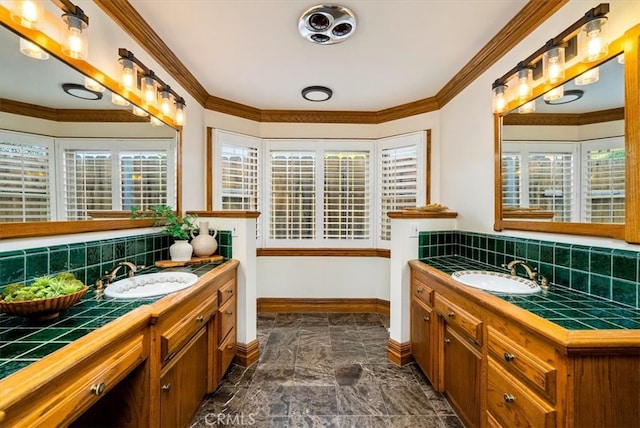 bathroom with decorative backsplash, vanity, and plenty of natural light