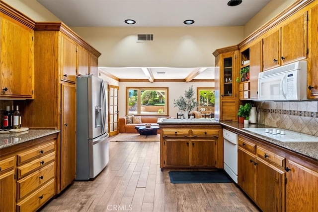 kitchen featuring dark wood-type flooring, tasteful backsplash, white appliances, ornamental molding, and sink