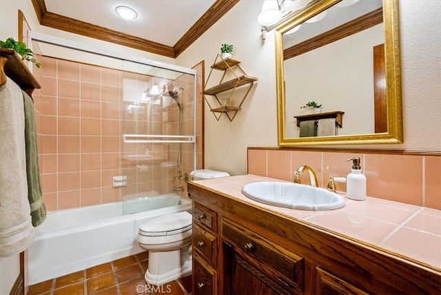 full bathroom with decorative backsplash, ornamental molding, vanity, tiled shower / bath, and toilet