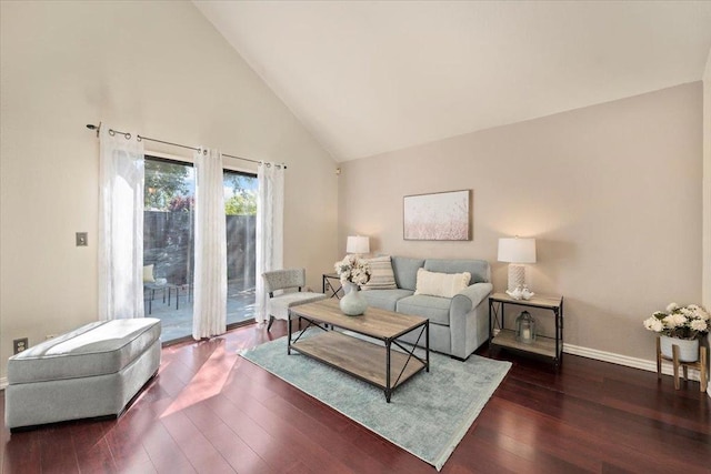 living room with dark wood-type flooring and high vaulted ceiling