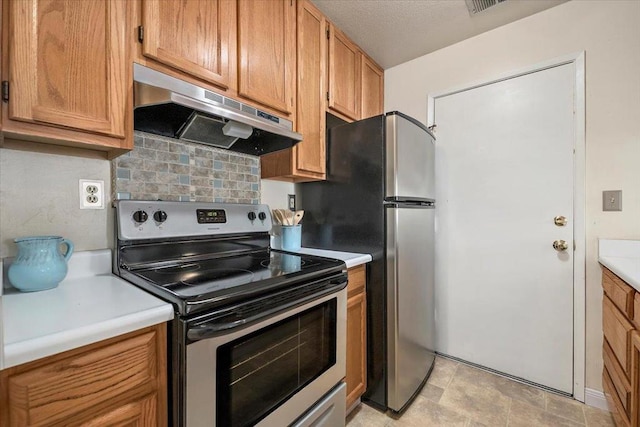 kitchen featuring stainless steel appliances and backsplash