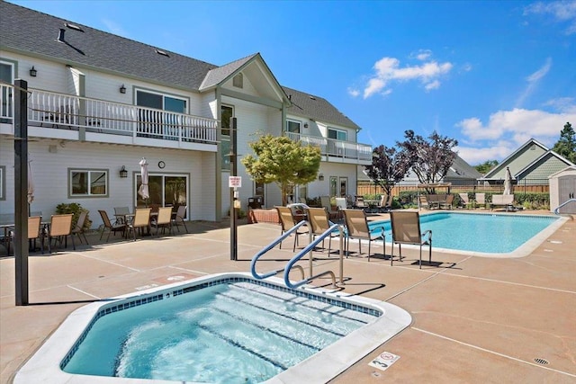 view of swimming pool with a patio