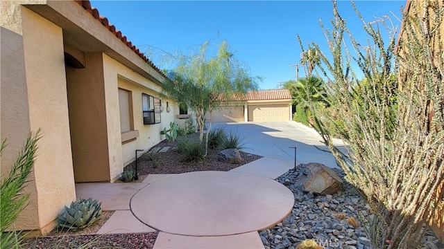 view of patio / terrace with a garage