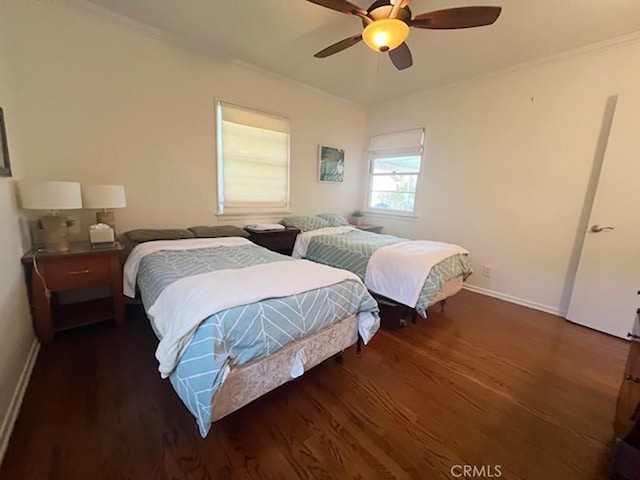 bedroom featuring ceiling fan, crown molding, and dark wood-type flooring