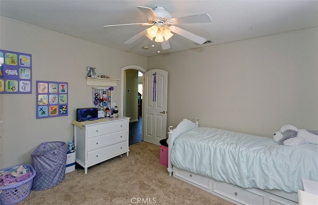 bedroom with light carpet and ceiling fan