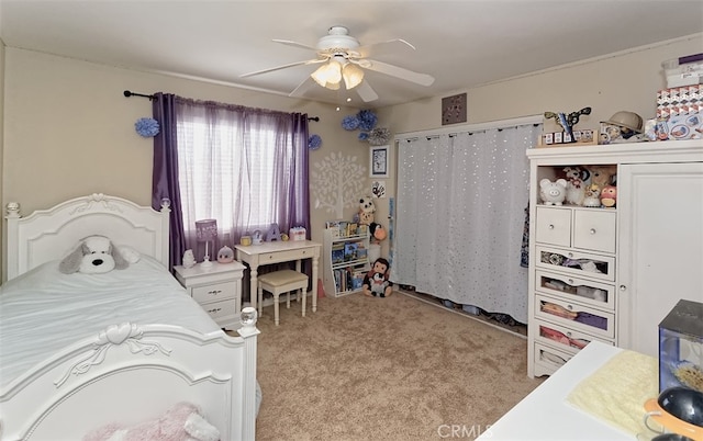 carpeted bedroom with ceiling fan