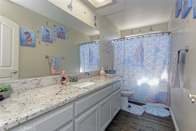 bathroom with vanity, toilet, hardwood / wood-style flooring, and a shower with shower curtain