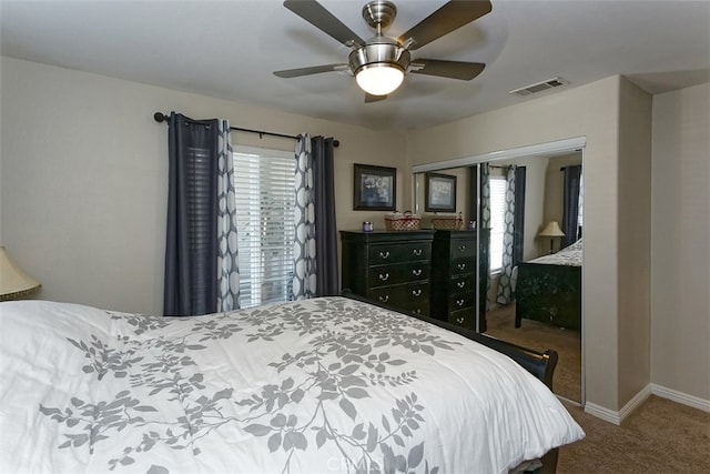 bedroom featuring ceiling fan and carpet