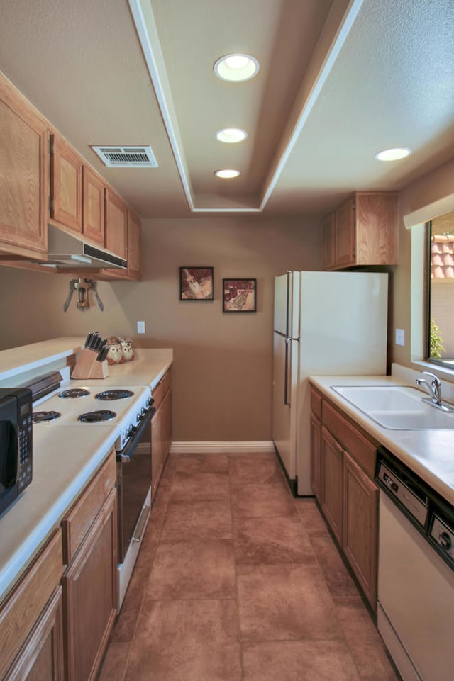 kitchen featuring sink and white appliances