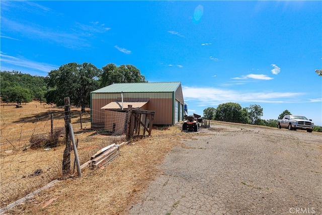 view of outdoor structure featuring a rural view