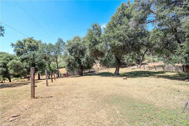 view of yard with a rural view