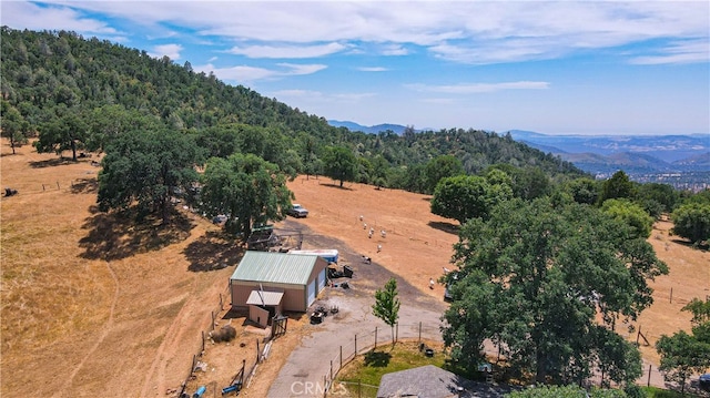 birds eye view of property with a mountain view and a rural view