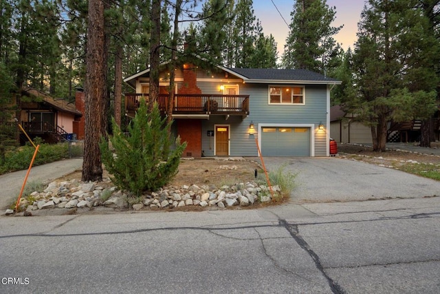 view of front property featuring a deck and a garage