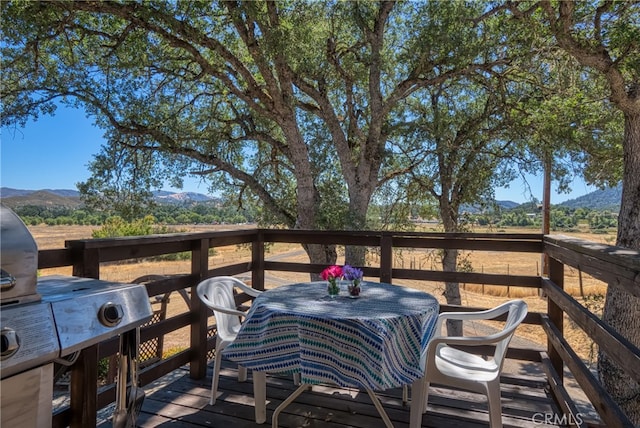 wooden deck featuring a mountain view