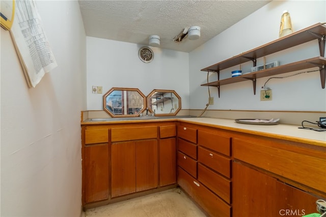 kitchen featuring a textured ceiling