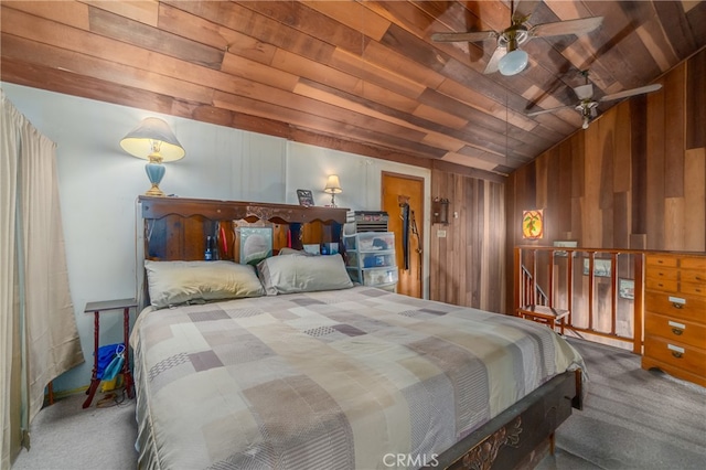 carpeted bedroom with wooden ceiling, lofted ceiling, wooden walls, and ceiling fan