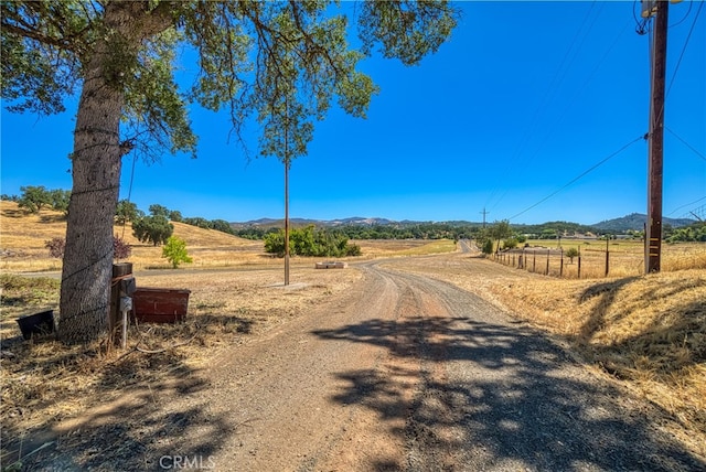 view of road featuring a mountain view and a rural view