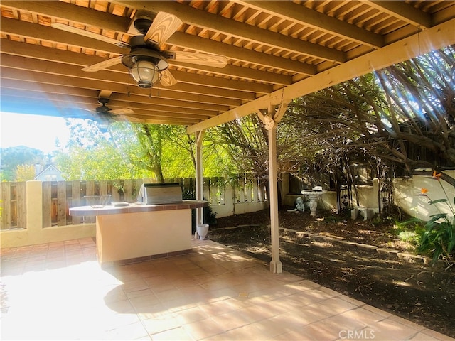 view of patio with ceiling fan and exterior kitchen