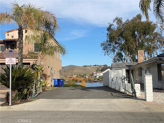 view of street with a water and mountain view