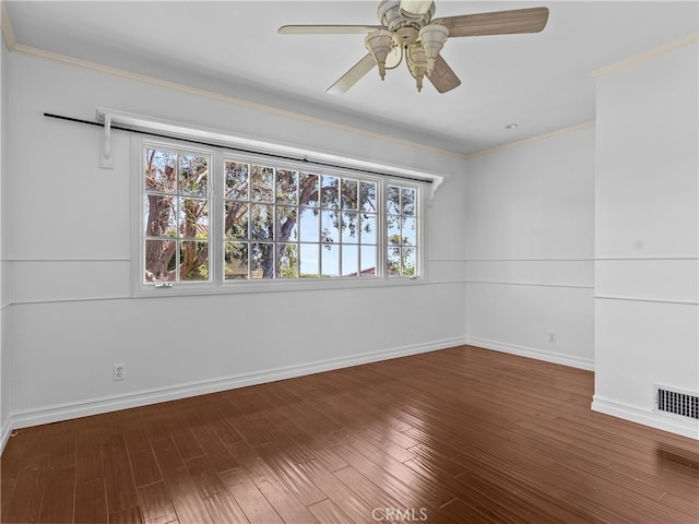 empty room with ornamental molding, ceiling fan, and hardwood / wood-style floors