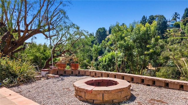 view of patio with a fire pit