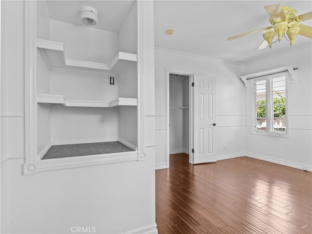 walk in closet featuring ceiling fan and dark hardwood / wood-style floors