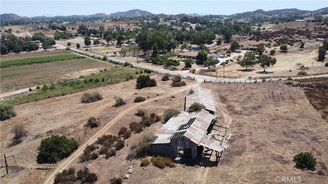 birds eye view of property with a rural view and a mountain view