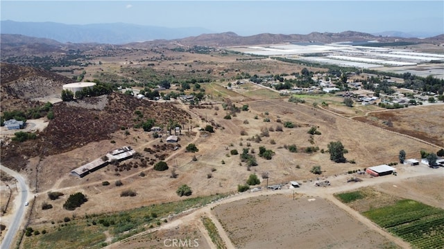 aerial view with a mountain view and a rural view