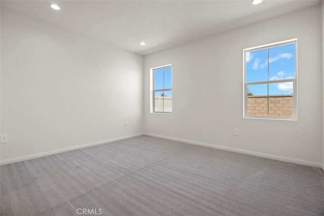 carpeted empty room featuring a healthy amount of sunlight