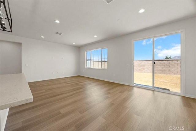 unfurnished living room with hardwood / wood-style floors