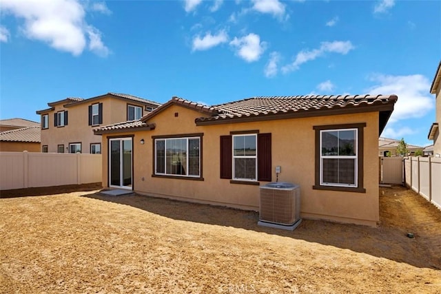 back of property featuring central AC unit