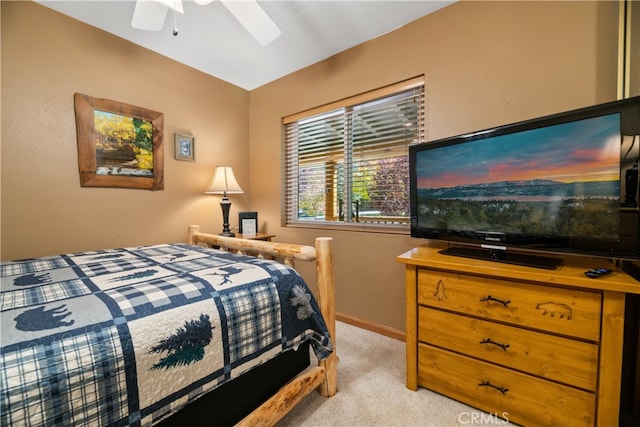 bedroom with ceiling fan and light colored carpet