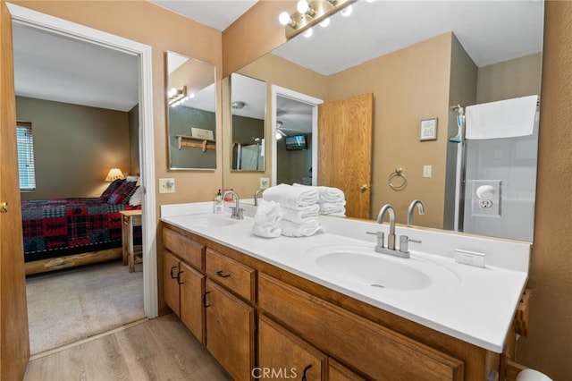 bathroom featuring vanity and hardwood / wood-style flooring