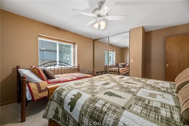 bedroom featuring a closet, ceiling fan, and carpet flooring