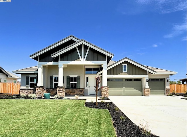 craftsman-style house with a front lawn and a garage