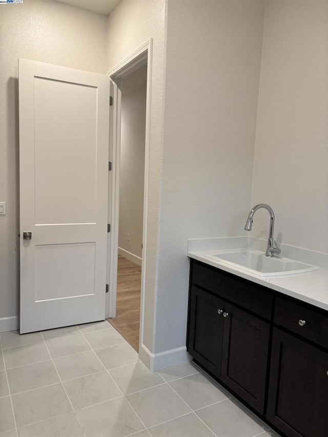 bathroom with vanity and tile patterned flooring