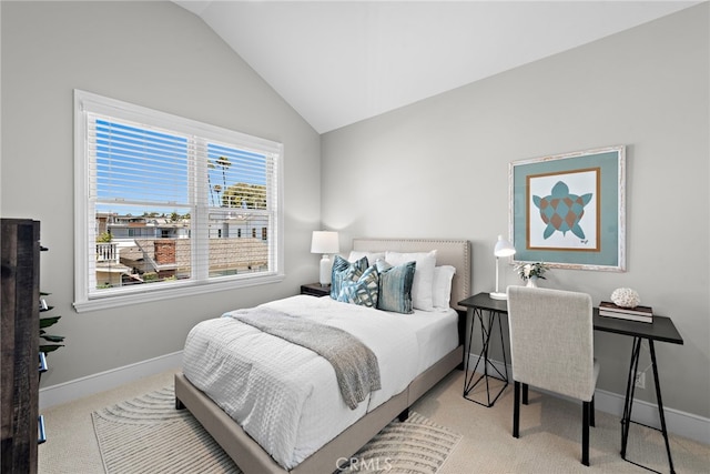 carpeted bedroom featuring lofted ceiling