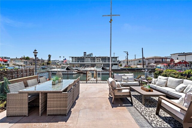 view of patio / terrace featuring an outdoor hangout area and a water view